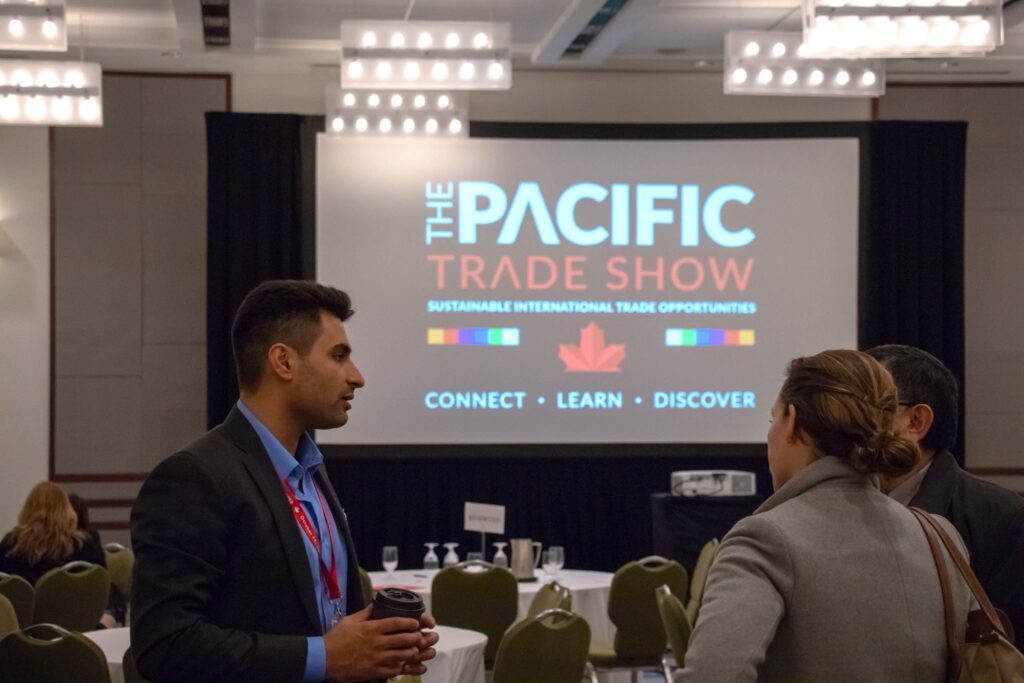 Stephen Ruhland discussing freight and logistics with an attendee at the Pacific Trade Show